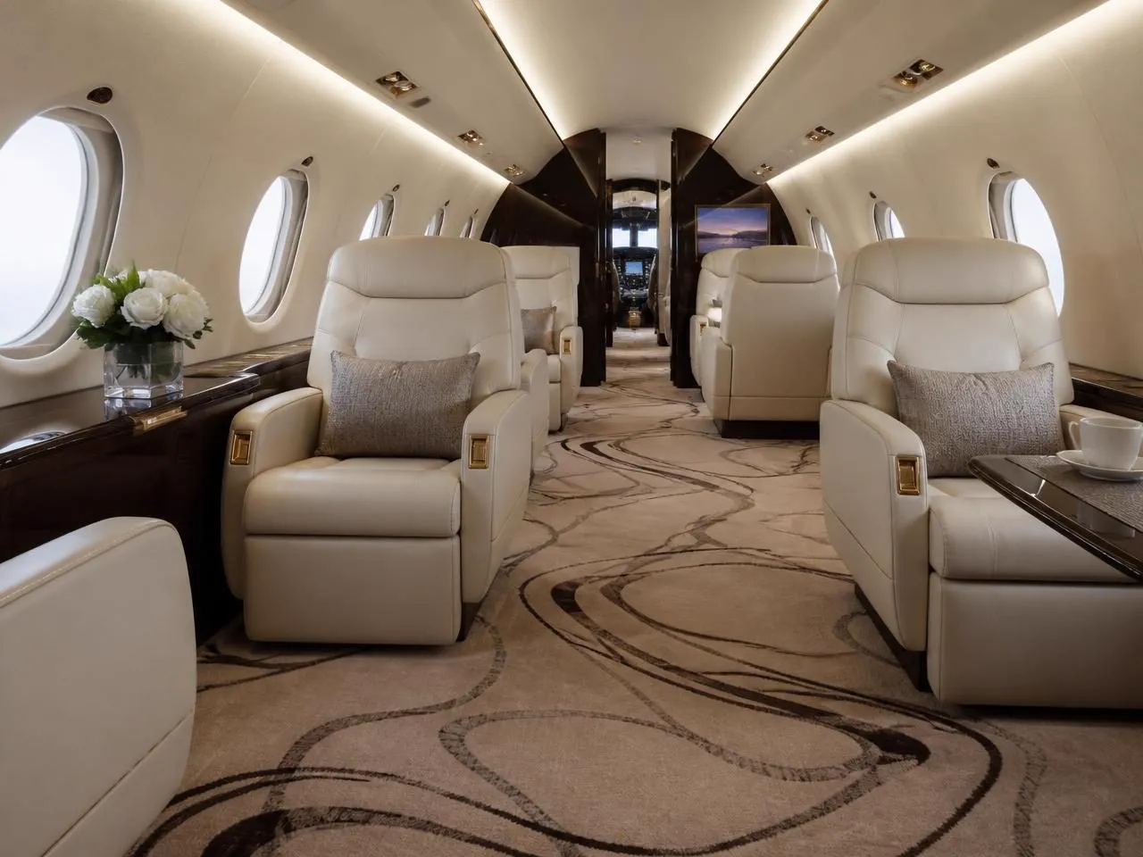 Bespoke patterned wool carpet running down the aisle of a luxury private jet cabin